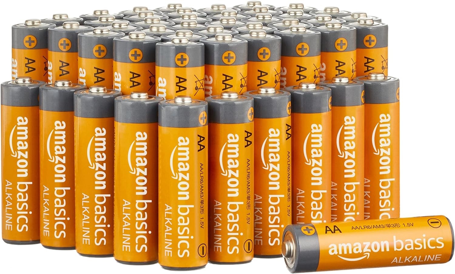 A large number of orange AA batteries on their ends arranged in a tight formation